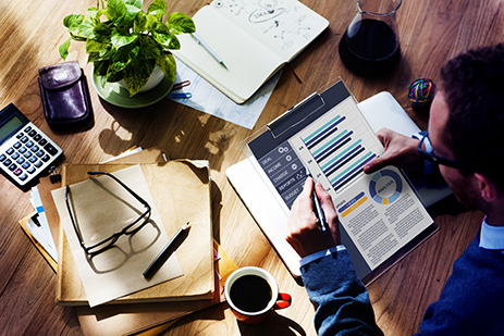 Photo of a man at a messy desk